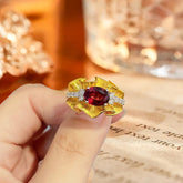 Glojewels Two Tone Bold Artistic Red Natural Garnet Oval Cut Silver Ring