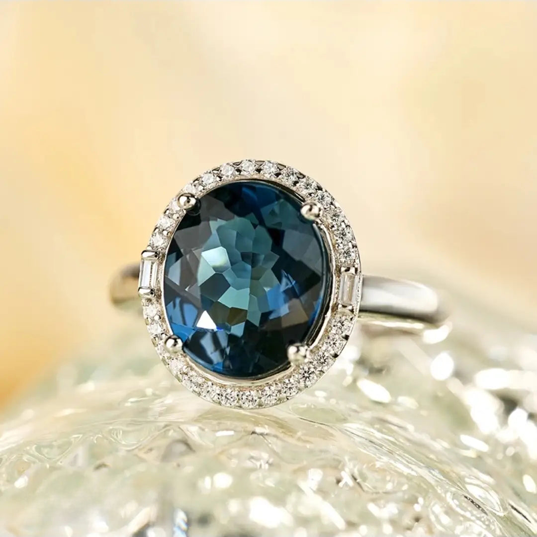 Glojewels Timeless Elegant Halo Blue Natural Topaz Oval Cut Silver Ring