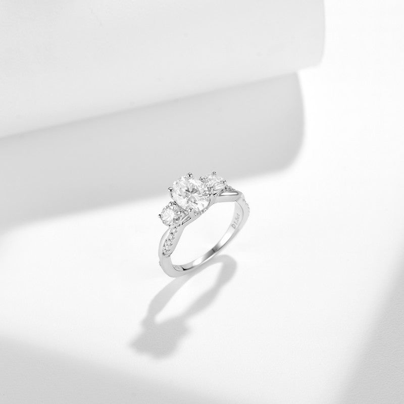 Glojewels Three Stone Twist 1.5ct White Moissanite Oval Cut Silver Ring