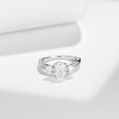 Glojewels Three Stone Twist 1.5ct White Moissanite Oval Cut Silver Ring