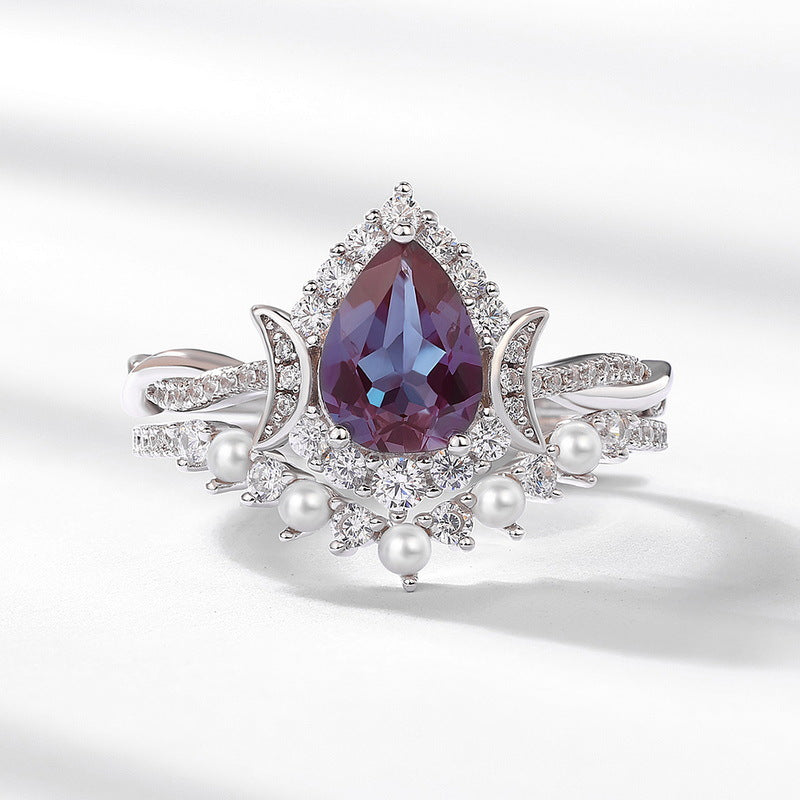 Glojewels 2pc Halo Twist Pearl Alexandrite Pear Cut Silver Ring Set