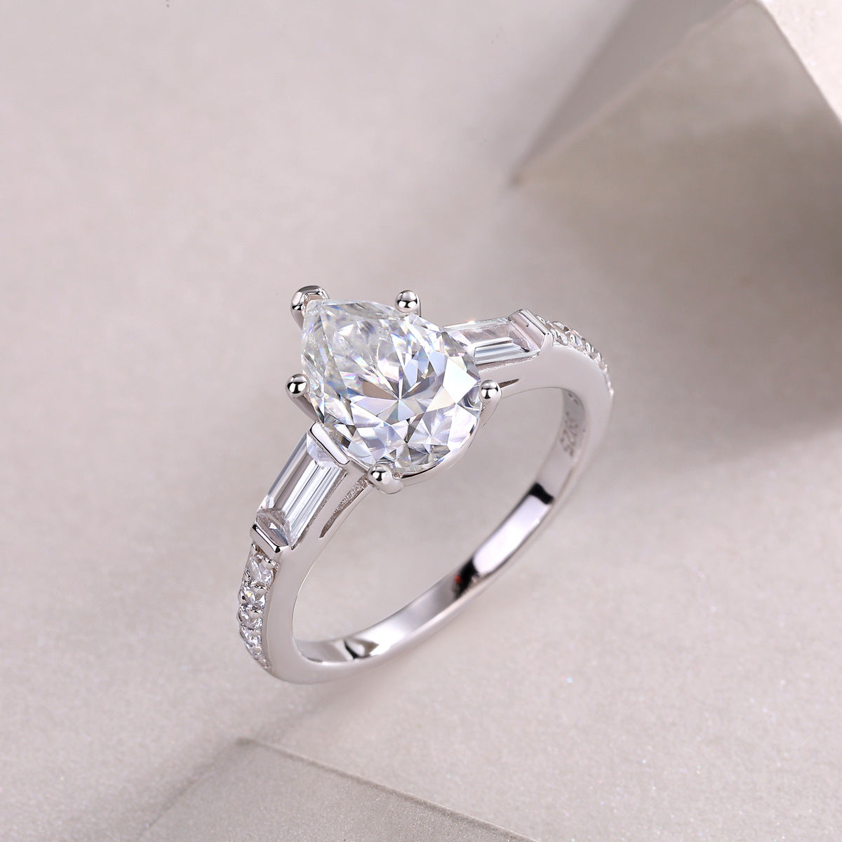 Glojewels Three Stone White Sapphire 1.5ct Moissanite Pear Cut Silver Ring