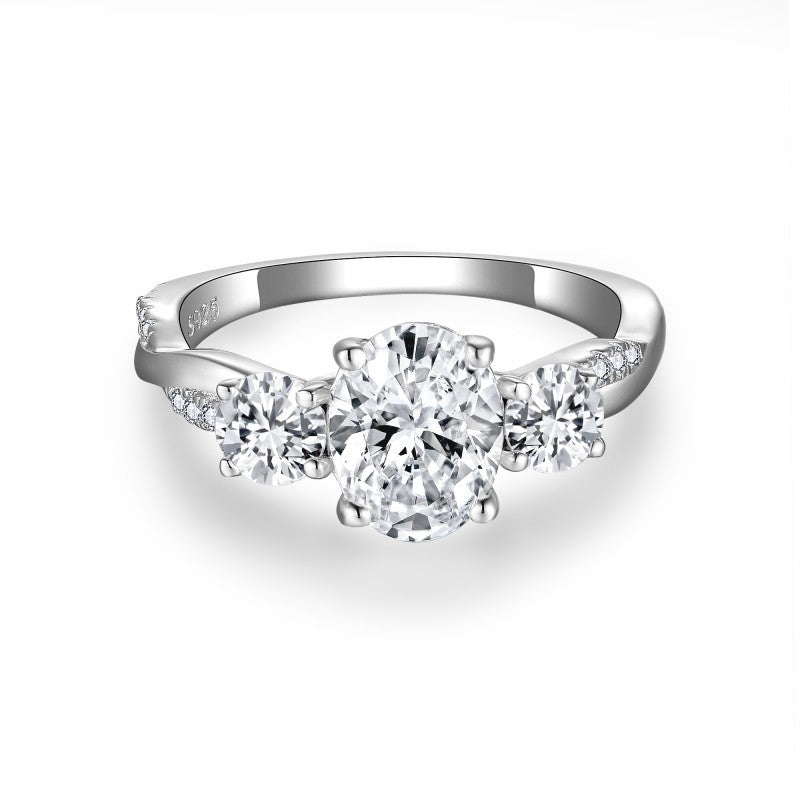 Glojewels Three Stone Twist 1.5ct White Moissanite Oval Cut Silver Ring